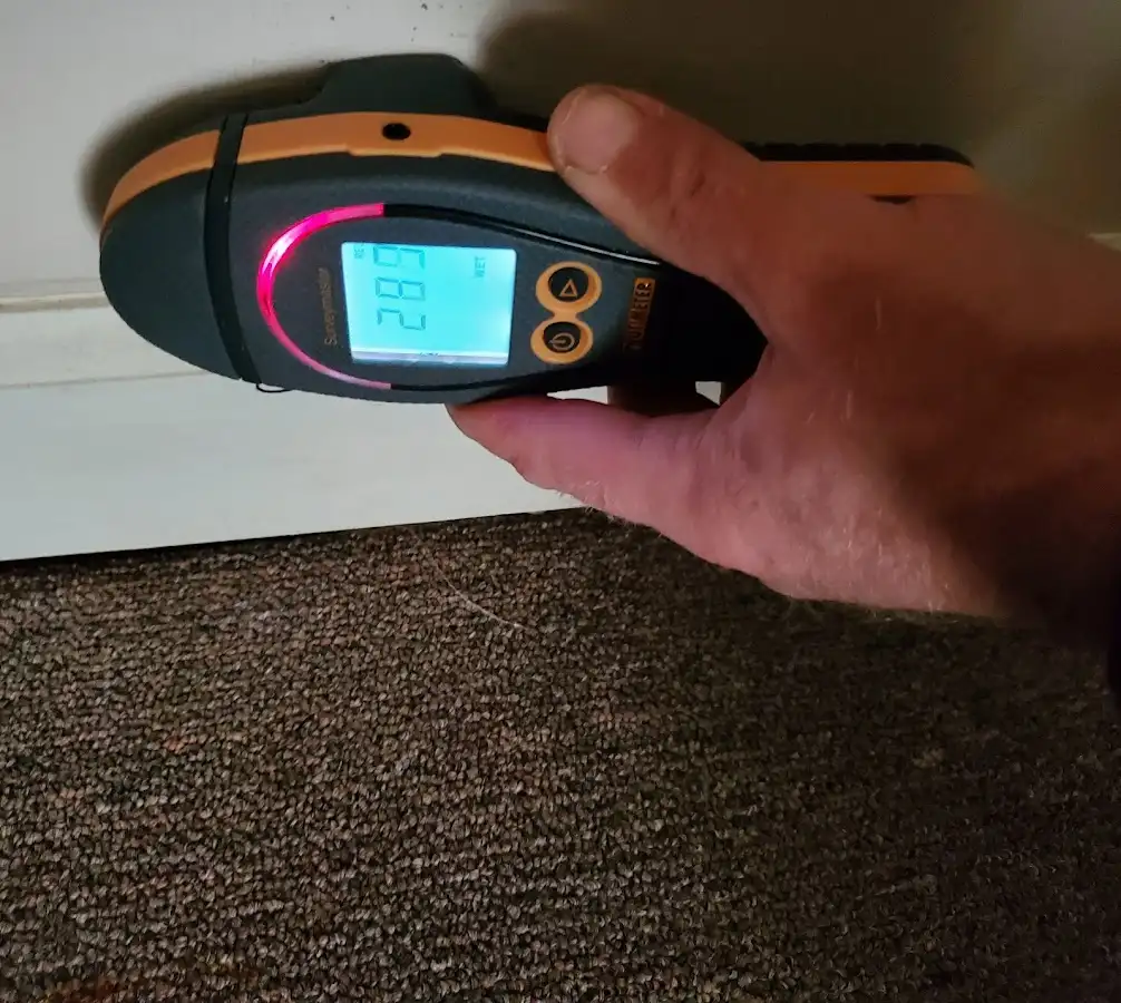 Moisture detection at baseboard during Sewage Cleanup & Sanitation in Lawrenceville